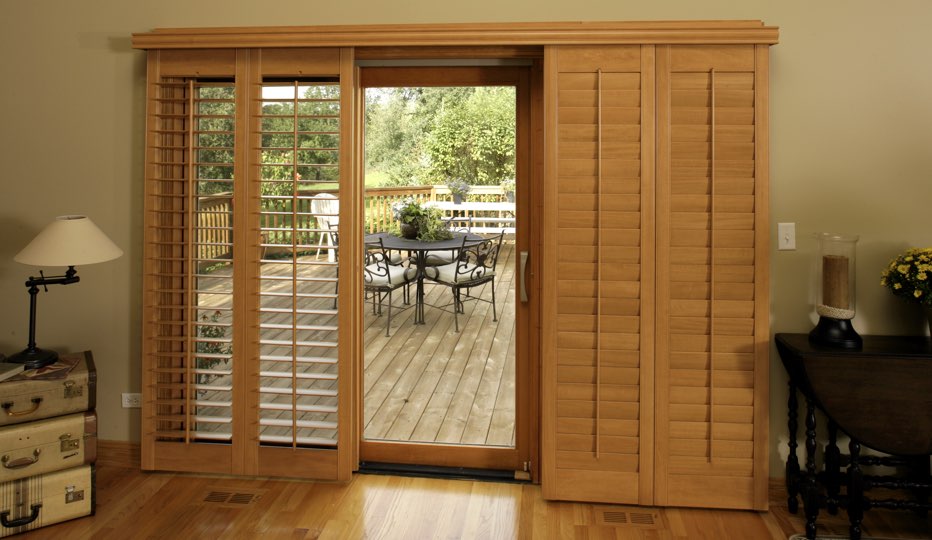 Wood bypass patio door shutters in Clearwater living room